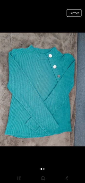 Pull avec fantaisie bouton