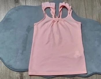 Débardeur tape à l'oeil abricot 6 ans en très bon état