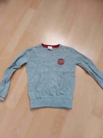 Pull gris moucheté poche devant