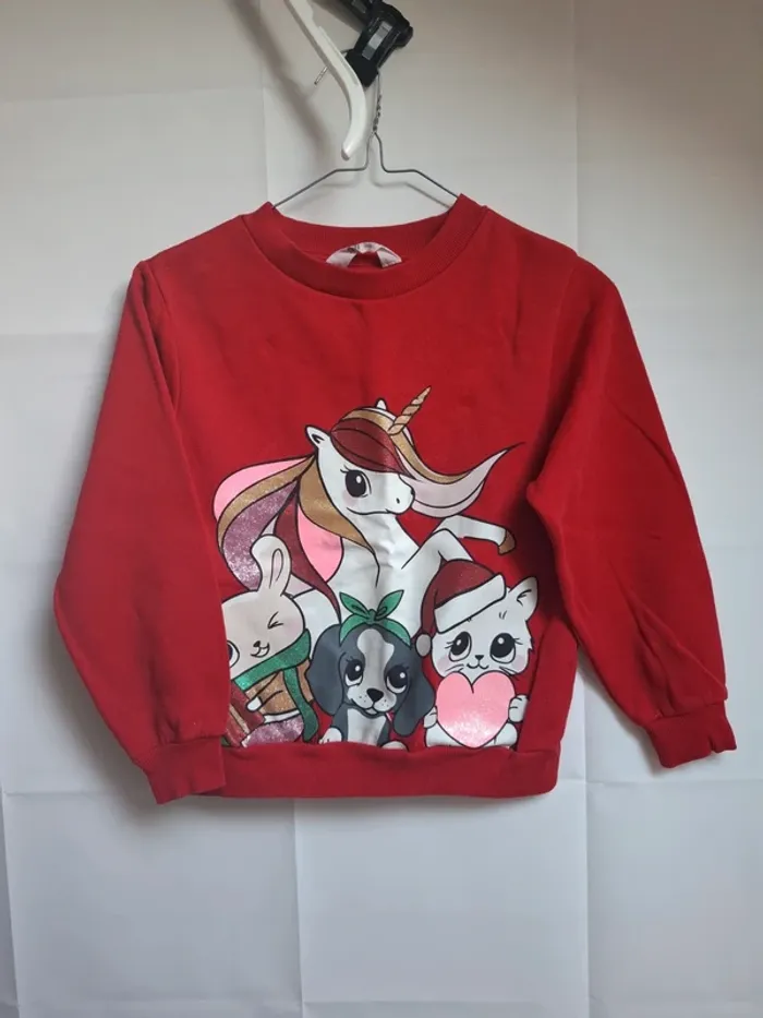 Pull taille 6.8 ans