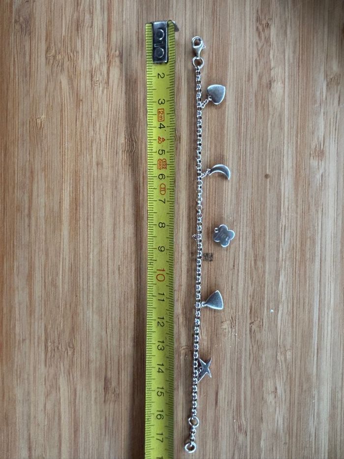Bracelet Mauboussin 5 charms dont 1 à faire remonter