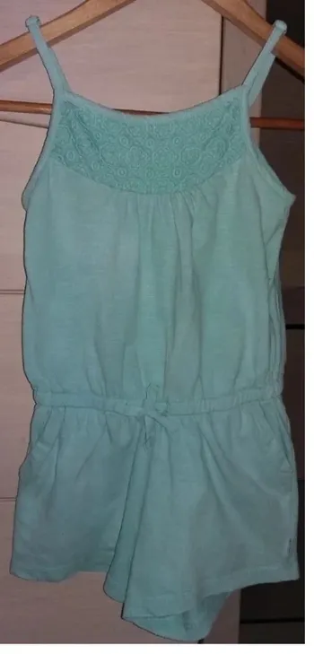 combinaison courte / combishort OKAIDI 6 ans en bon état