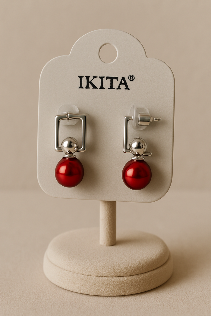 Boucle d'oreille neuf de marque Ikita, en acier inoxydable.