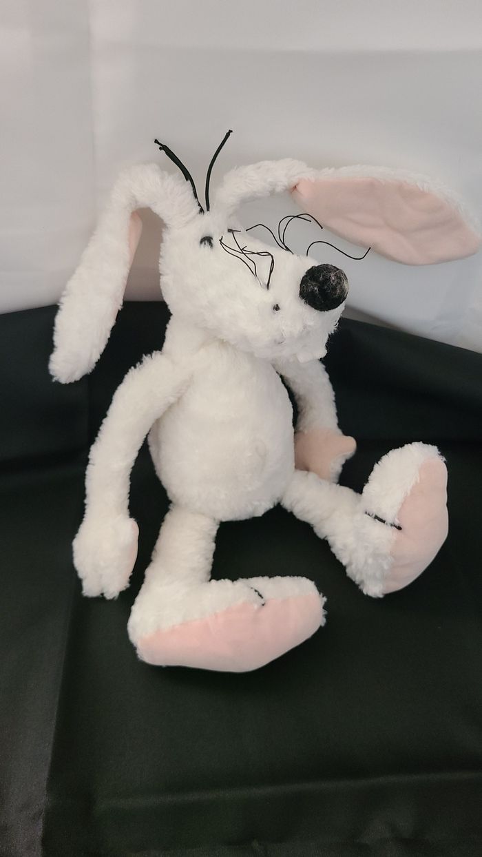 doudou chien blanc oreilles intérieur rose