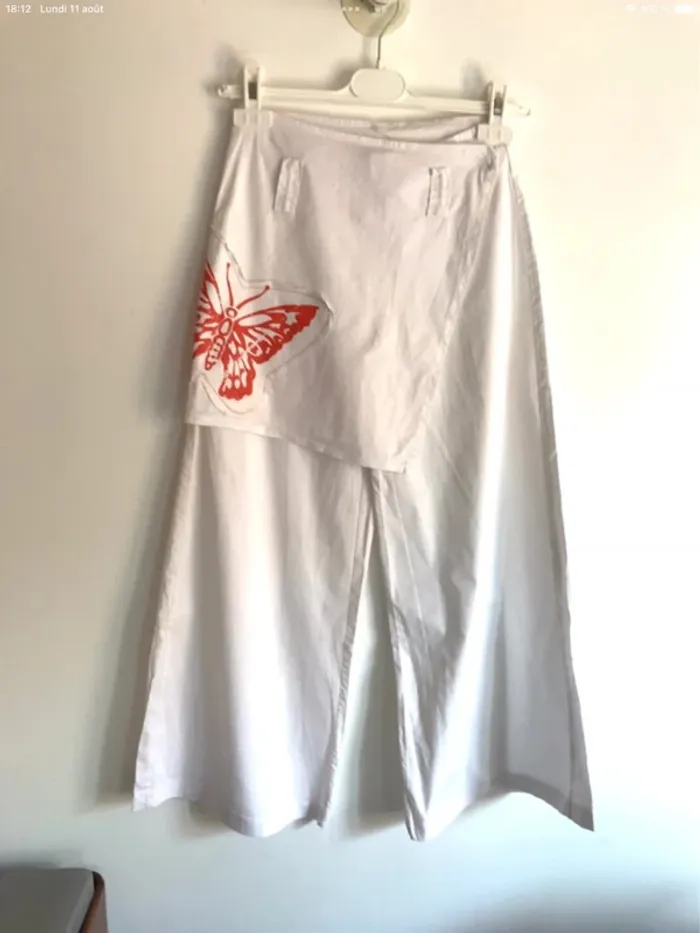 Pantalon large blanc Fashion Express 12 ans avec papillon orange sur le côté