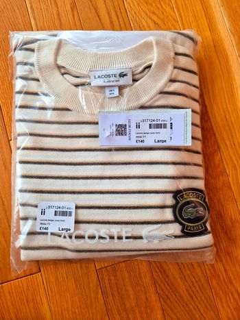 Pull "Lacoste" Blanc à rayures Taille L  Taille L neuf sous blister 100 % coton organique.