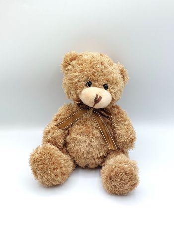 Petite peluche ours marron beige RENAUD Distribution nœud 20 cm doudou yeux durs