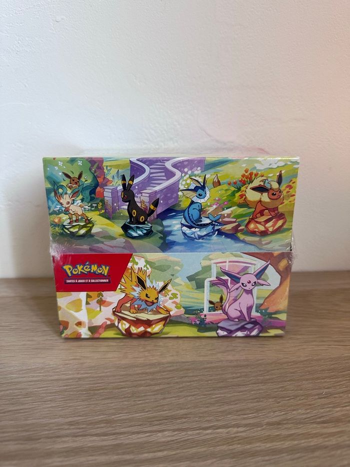 Display Pokémon mini tins Ev8.5 Évolutions Prismatiques scellée