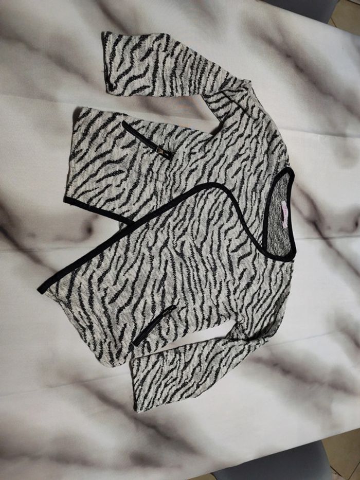 Gilet a paillettes zèbre gémo 8 ans