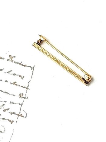 Broche vintage plaqué or épingle cravate