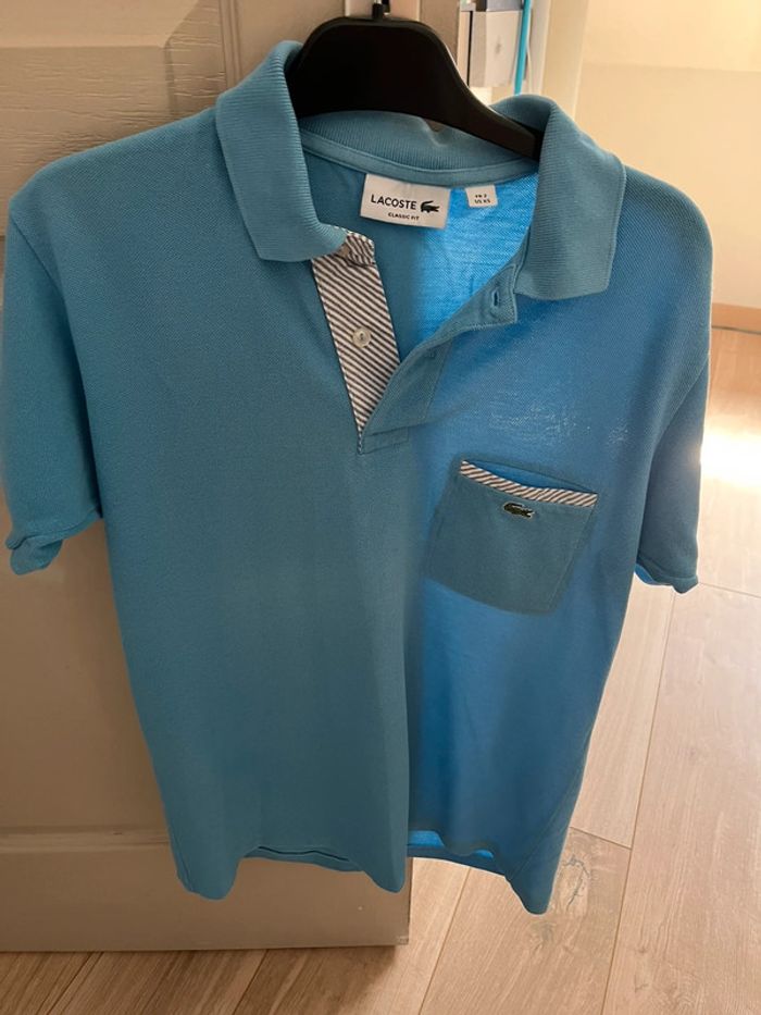 Polo bleu clair Lacoste
