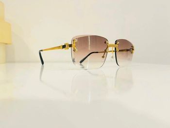 Lunette de soleil mixte percée dorée verres marron dégradés UV protection catégorie 2