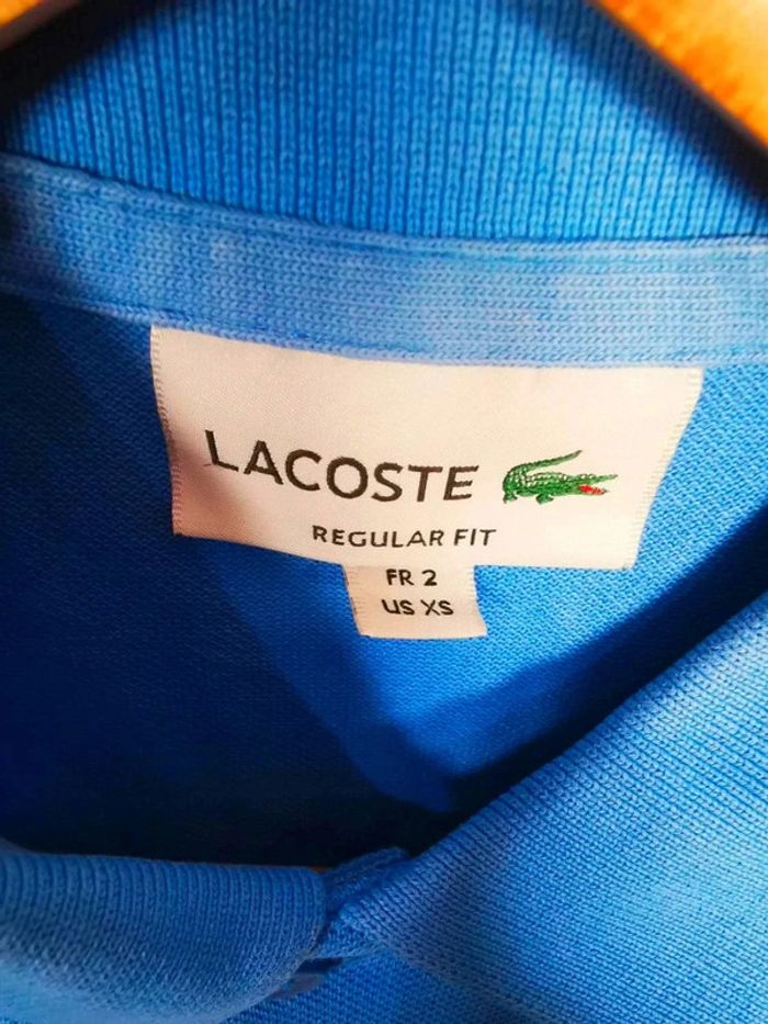 C29 polo bleu Lacoste T2 - photo numéro 3