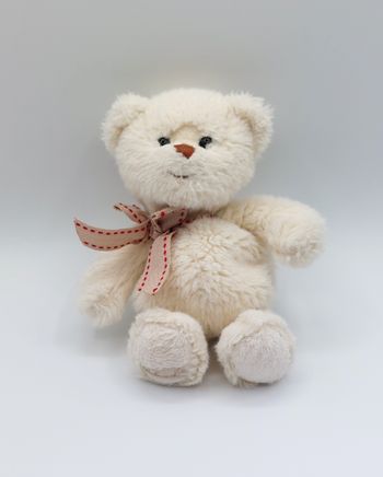 Petite peluche doudou ours écru crème BUKOWSKI nœud beige fil rouge 18 cm sos doudou