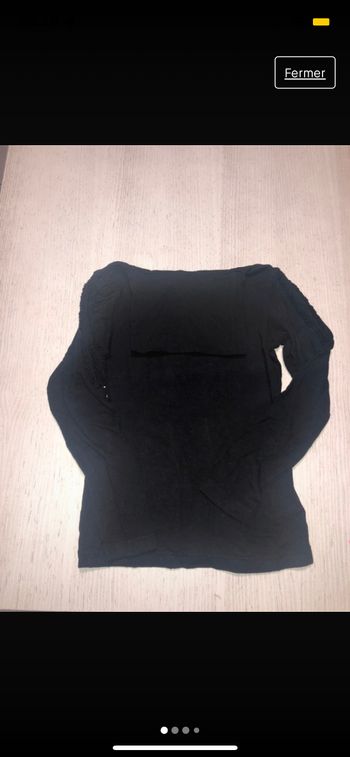 Col roulé noir avec strass sur les épaules