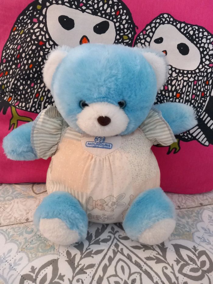 Peluche doudou vintage ours nounours yeux bleu 1990
Mesure 25cm