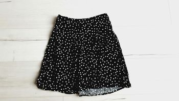 Vêtement femme mini jupe noire à pois blancs Kiabi taille 34