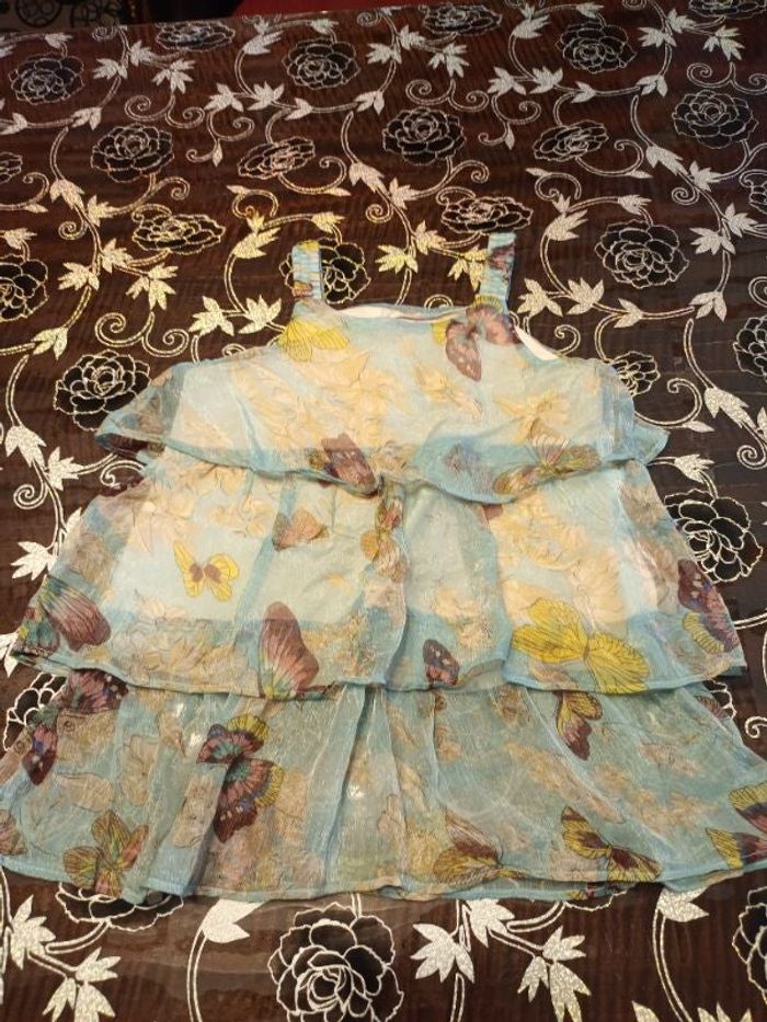 Blouse volants à bretelles turquoise imprimée fleurs et papillons