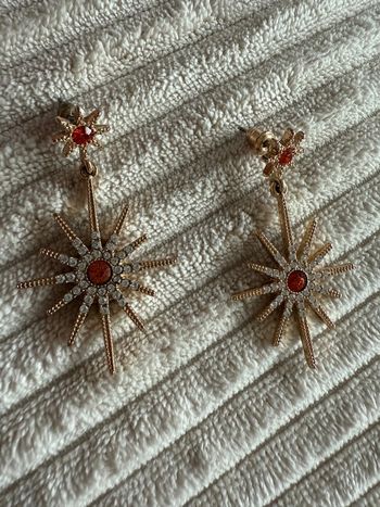Paire de boucles d’oreilles soleil