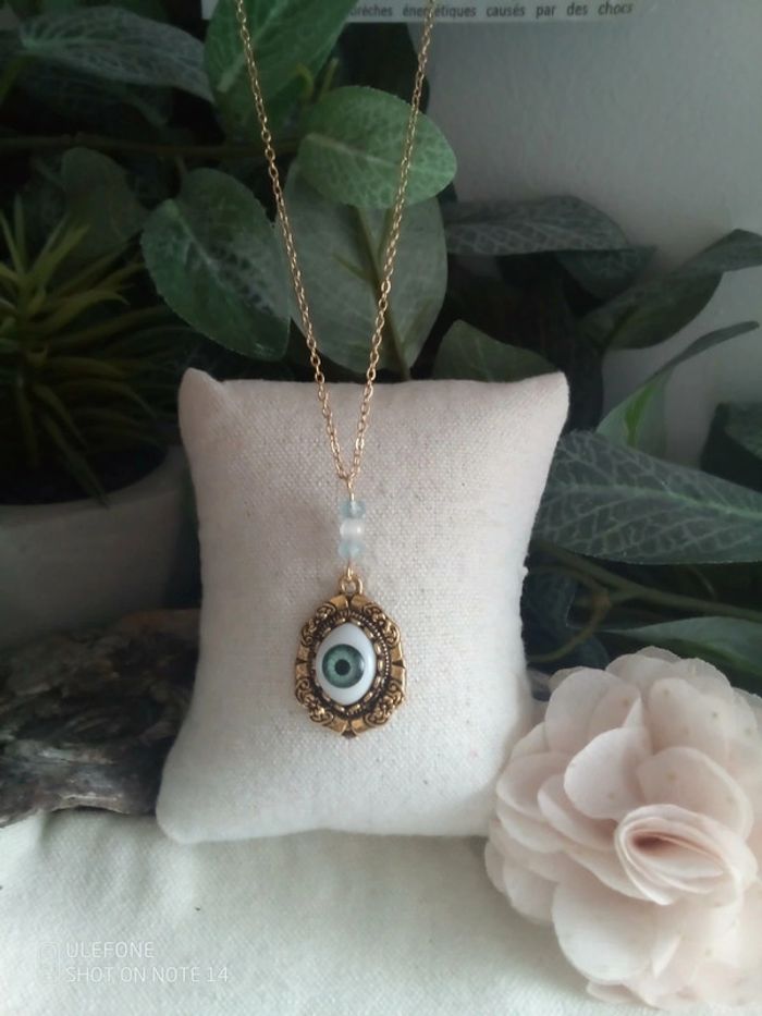 Collier oeil et pierres aigue marine et sélénite