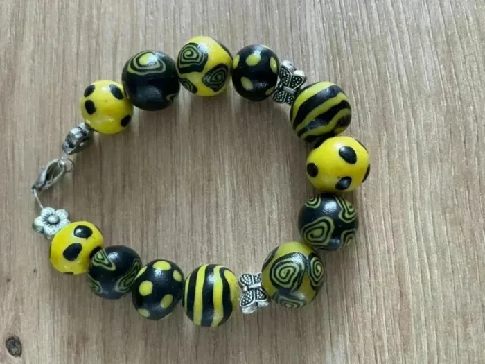 Bracelet jaune et noir à pois et rayure
