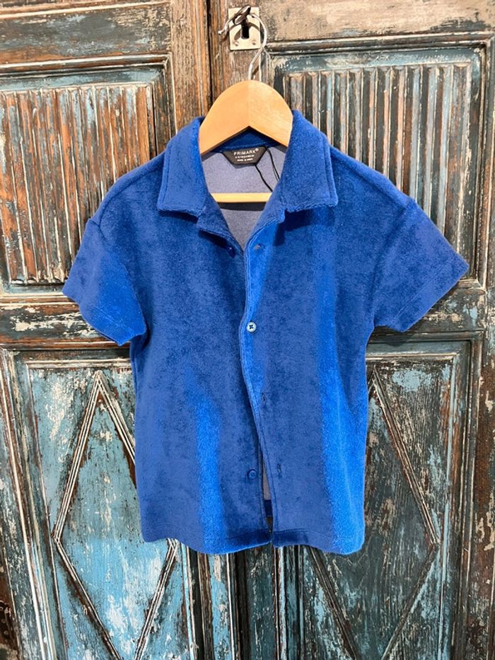 Joli chemise bleue à manches courtes