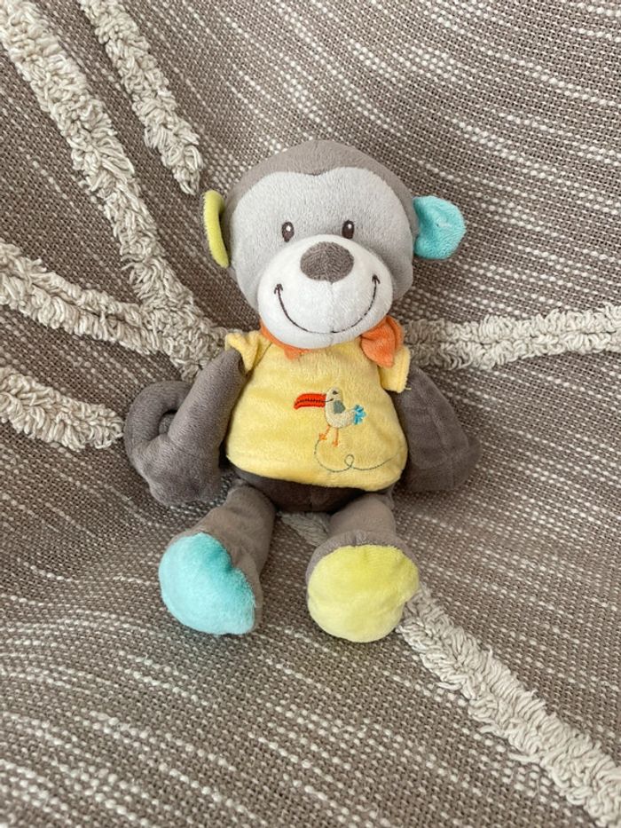 Peluche doudou 28cm Nicotoy singe gris et jaune très bon état