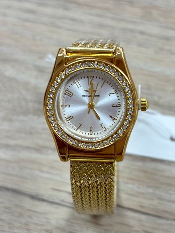 Montre femme dorée cadran rond blanc strass