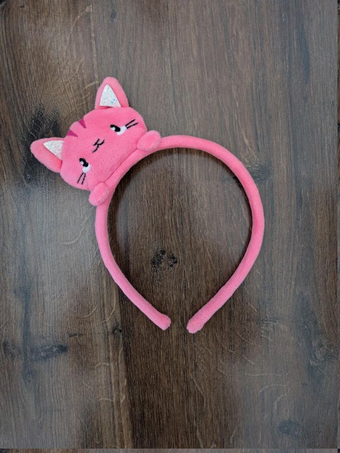 Serre tête avec tête de chat rose