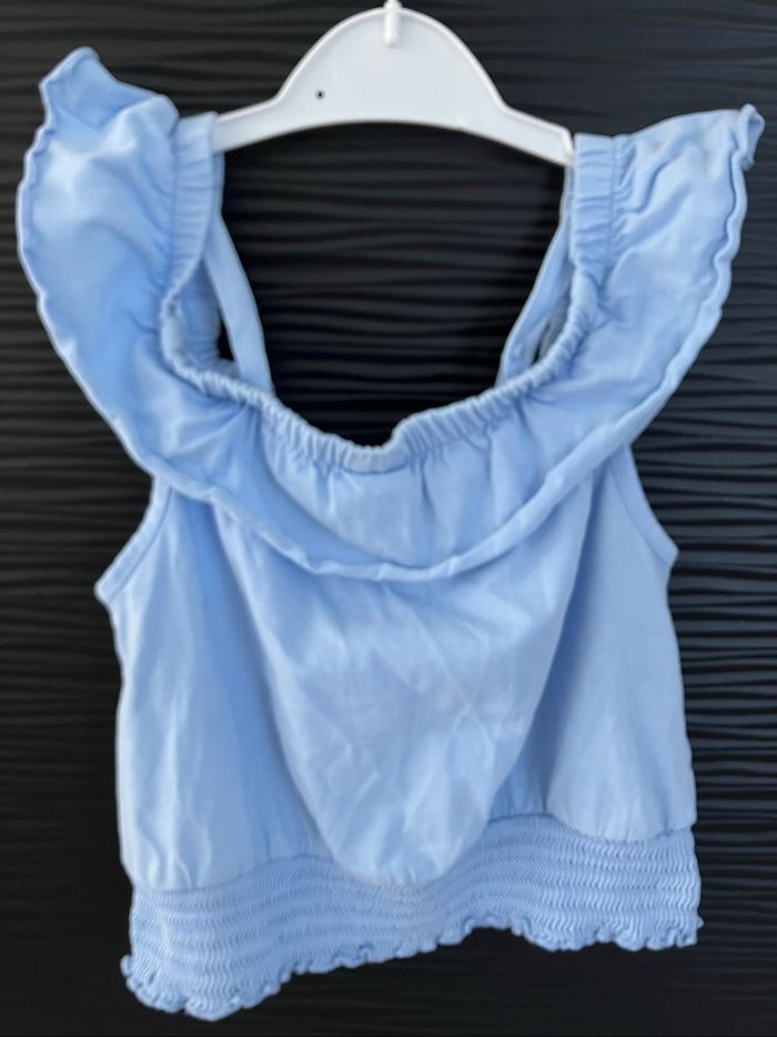 Débardeur bleu ciel C&A 8 ans