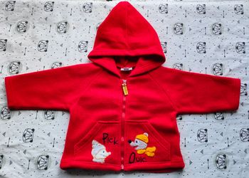 Veste polaire à capuche taille 6 mois