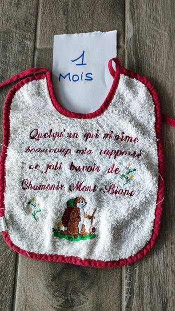 Bavoir à texte très bon état