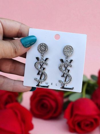 Boucle d'oreille Yves Saint Laurent  ✅
