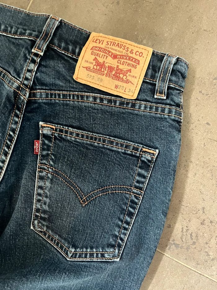 Jeans Lévis bleu brut 595 taille 28x34 - photo numéro 6