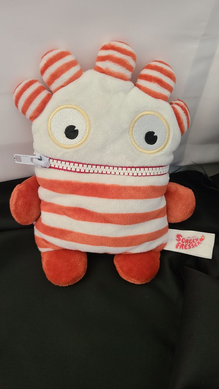 Schmidt- Peluche Soucis Bouffeur-Saggo