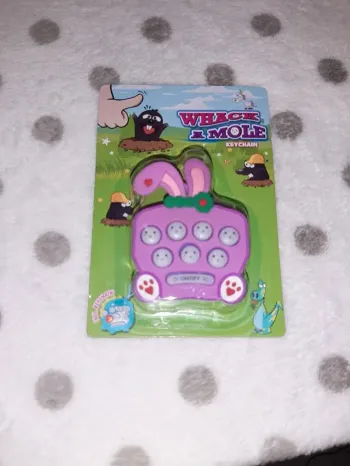 Jeu reflexe tape taupe avec porte clé à emporter neuf modèle lapin