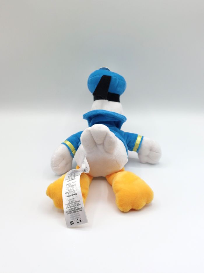 Peluche doudou Donald Duck DISNEYLAND Disneystore noeud rouge 30 cm comme neuf - photo numéro 5
