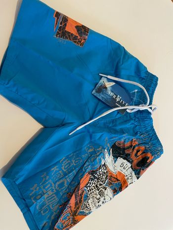Short de bain bleu taille 6 ans survive sport