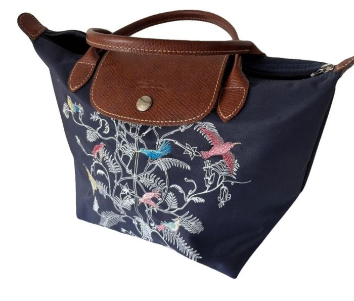 Sac longchamp à avoir et original