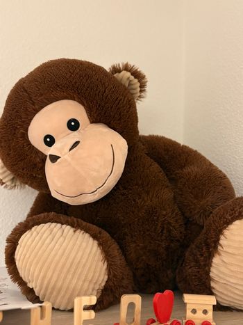 Grande peluche singe