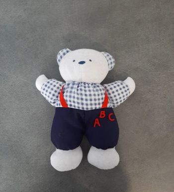 Peluche ours en salopette