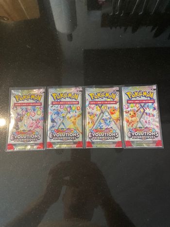 Neuf Artset 4 boosters Pokemon 8.5 évolutions prismatique