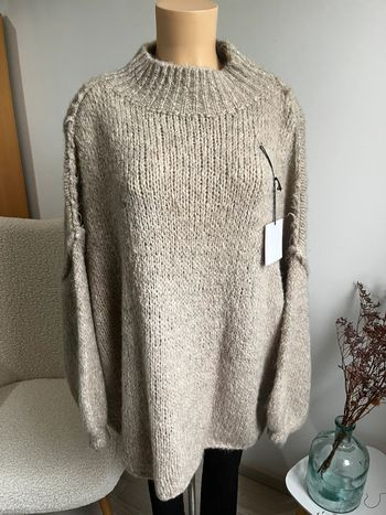 Pull beige à coutures apparentes