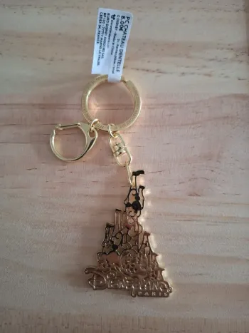 Porte-clés Disneyland Paris Château Dentelle (couleur or)