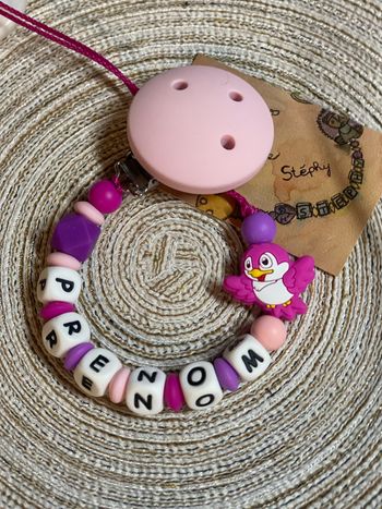 Attache tétine oiseau