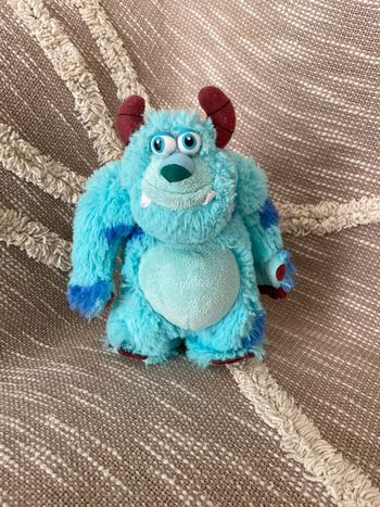 Peluche doudou 18cm Disney monstre et cie Sully bleu et violet très bon état
