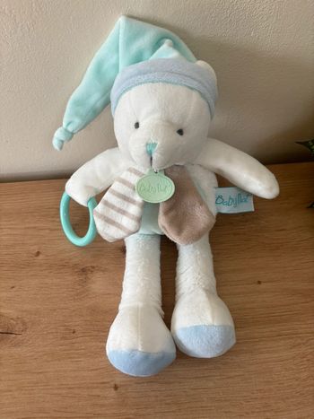 Doudou pantin ours activités blanc vert anneau pouet babynat