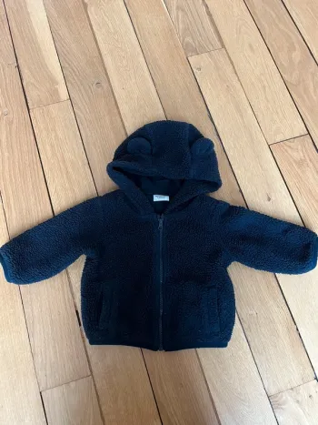 Veste moumoute bleu bébé tape à l’œil