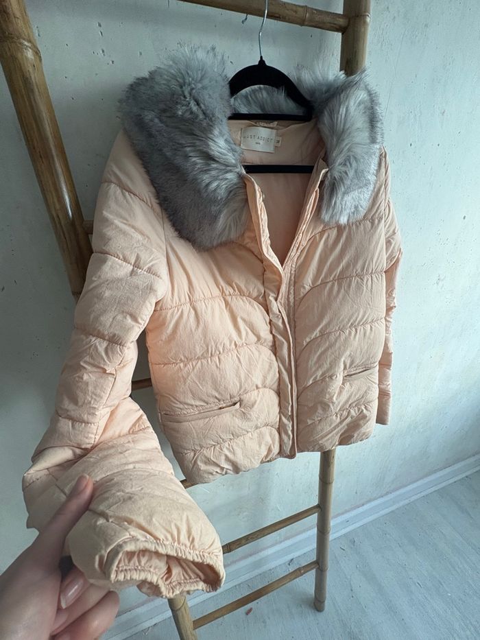 Manteau rose pâle