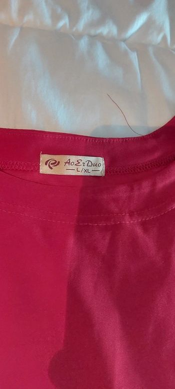 Pull avec écriture brillante